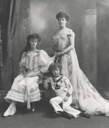 Viscountess Knollys and her children, photographed on the occasion of receiving King Edward VII Coronation medals, 1902